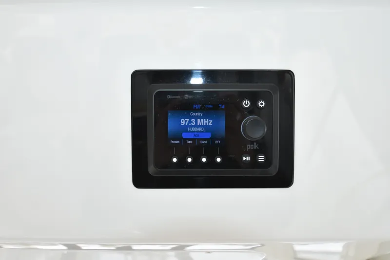 Slide: The Image of A built-in marine radio with a digital display set to 97.3 MHz. - 29