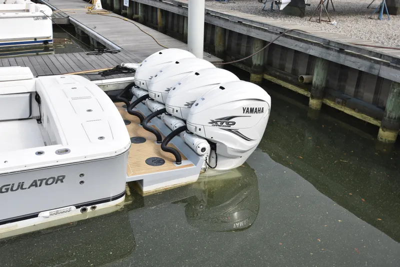Slide: The Image of A 2019 Regulator 41 FS with four Yamaha outboard engines docked at a pier. - 10