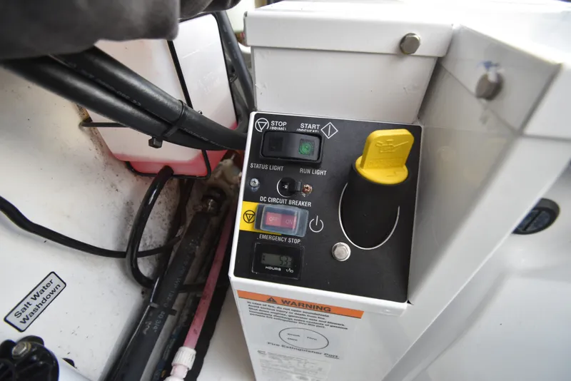 Slide: The Image of Close-up of a control panel with switches and indicators on a Regulator 41 FS boat. - 34