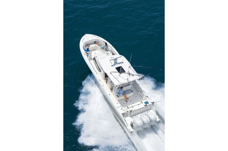 Slide: The Image of Aerial view of 2027 Pursuit S 388 Sport boat cruising on open water. - 3