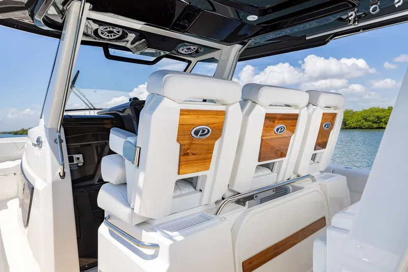 Slide: The Image of 2027 Pursuit S 388 Sport boat interior with luxurious seating and sleek design. - 13
