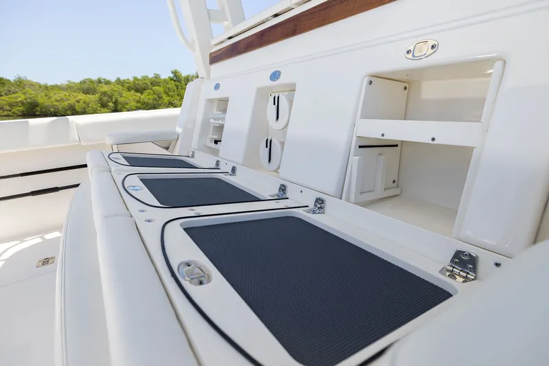 Slide: The Image of 2027 Pursuit S 388 Sport boat interior with storage compartments and sleek design. - 21