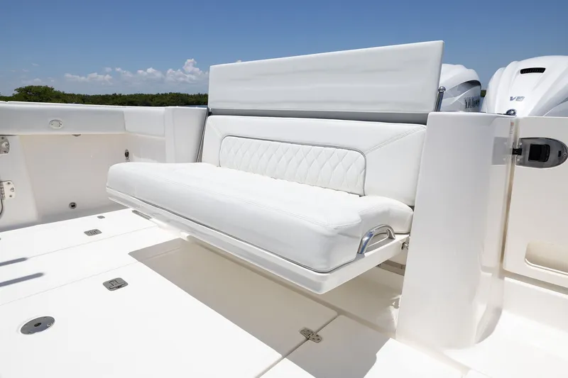 Slide: The Image of 2027 Pursuit S 388 Sport boat with luxurious white seating and sleek design. - 23
