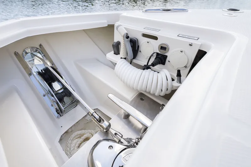 Slide: The Image of 2027 Pursuit S 388 Sport boat deck with anchor and coiled hose. - 5