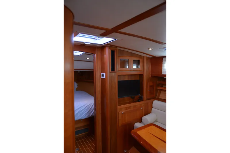 Slide: The Image of Interior of 2005 Sabre 38 Express yacht with wood finish and cozy seating area. - 74