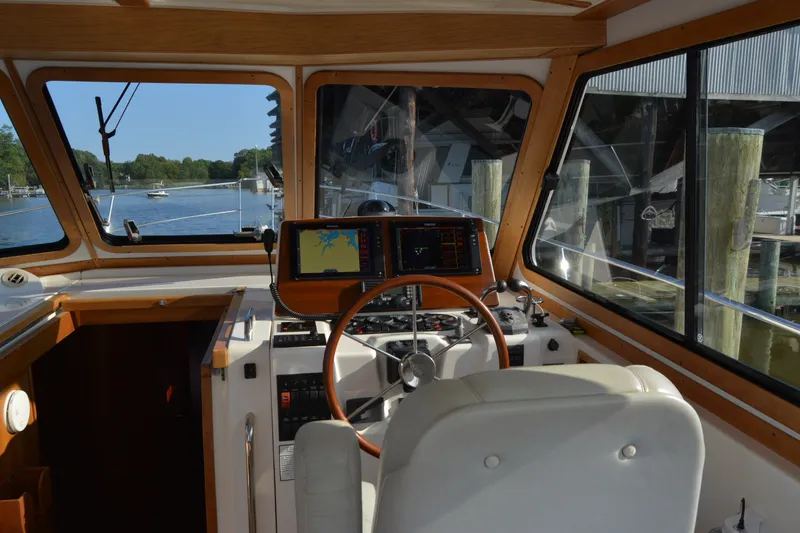 Slide: The Image of Interior view of 2005 Sabre 38 Express boat cockpit with navigation equipment. - 35