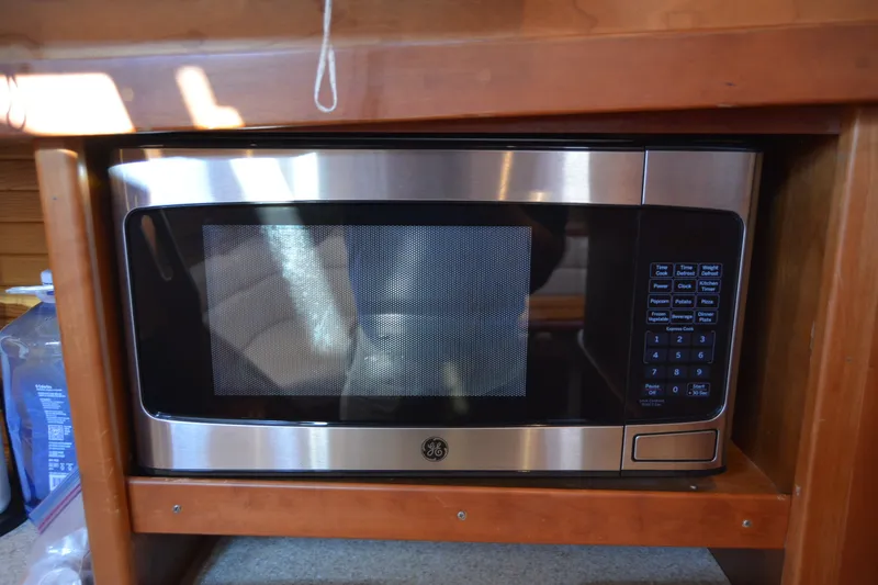 Slide: The Image of Microwave oven in 2005 Sabre 38 Express yacht kitchen area. - 69