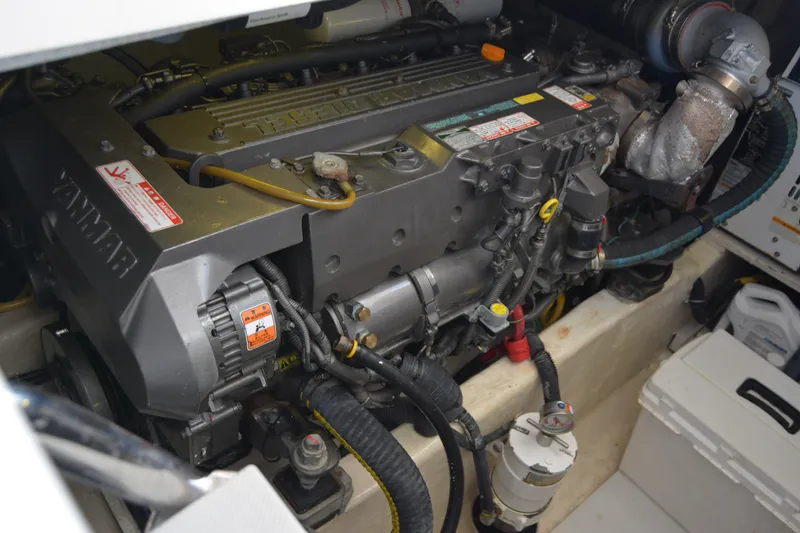 Slide: The Image of Engine compartment of a 2005 Sabre 38 Express boat, featuring a Yanmar engine. - 96