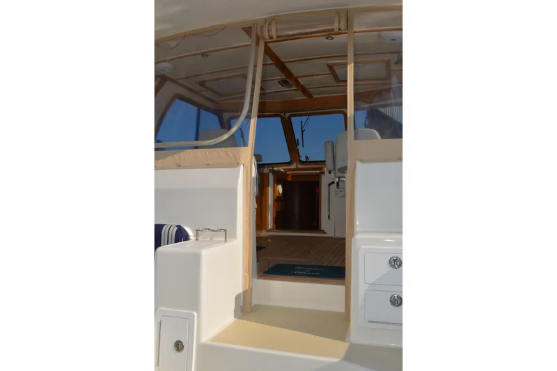 Slide: The Image of Interior view of 2005 Sabre 38 Express yacht, showcasing seating and helm area. - 25