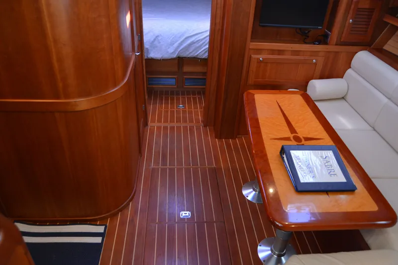 Slide: The Image of Luxurious 2005 Sabre 38 Express yacht interior with elegant wood finish and comfortable seating. - 65