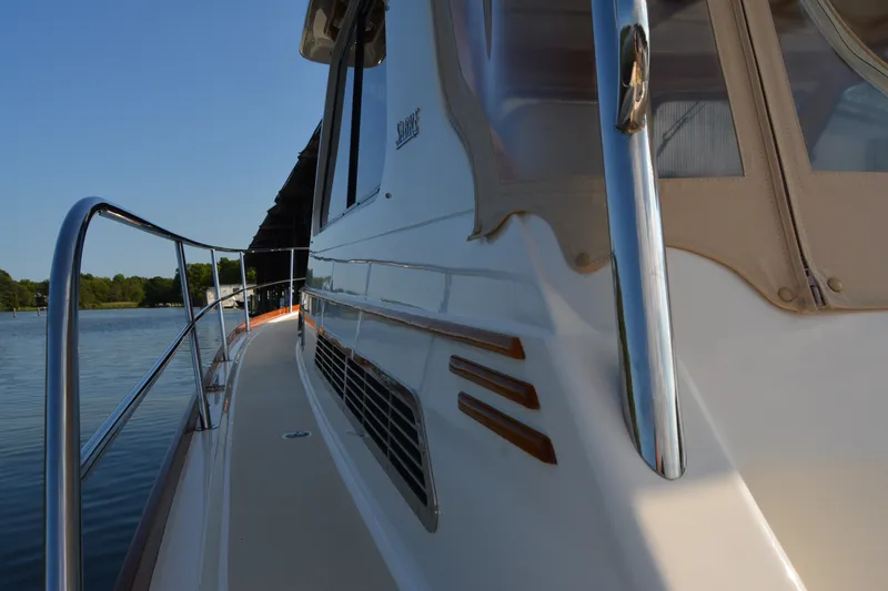 Slide: The Image of 2005 Sabre 38 Express yacht side view on calm water. - 20