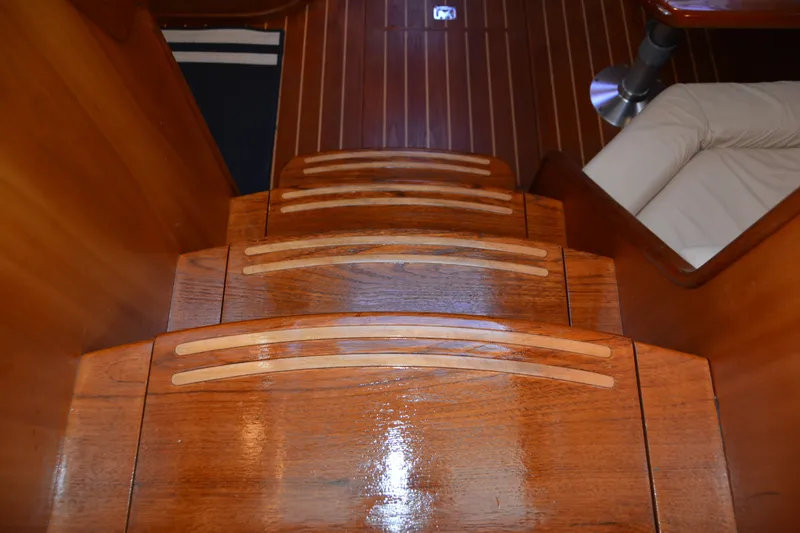 Slide: The Image of Wooden stairs inside a 2005 Sabre 38 Express yacht, featuring polished finish and elegant design. - 64