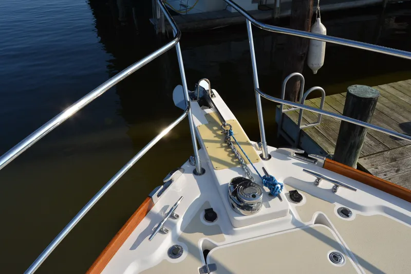 Slide: The Image of Bow of 2005 Sabre 38 Express yacht with anchor chain and railing. - 8