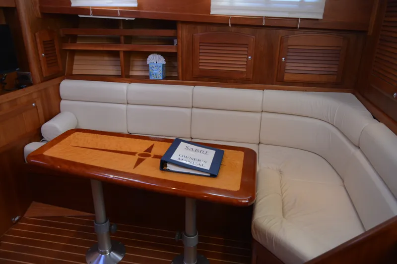 Slide: The Image of Luxurious interior of 2005 Sabre 38 Express yacht with elegant seating and wooden table. - 73