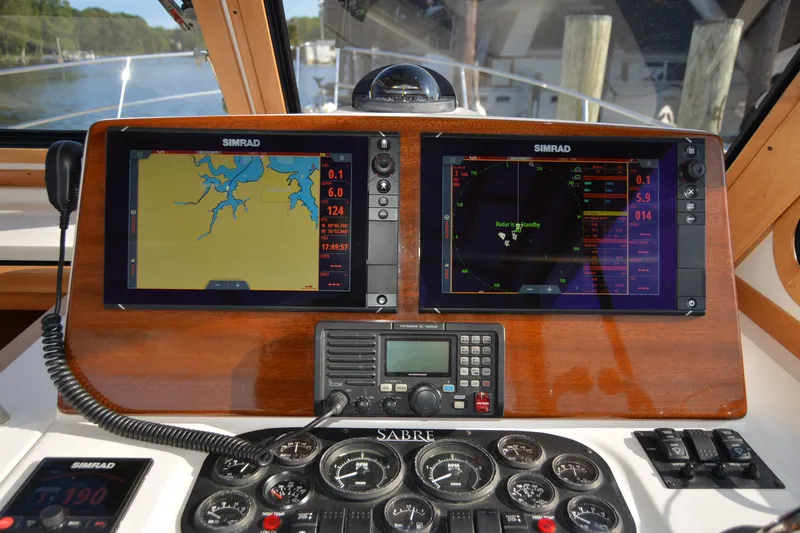 Slide: The Image of Dashboard of a 2005 Sabre 38 Express with navigation and communication equipment. - 41