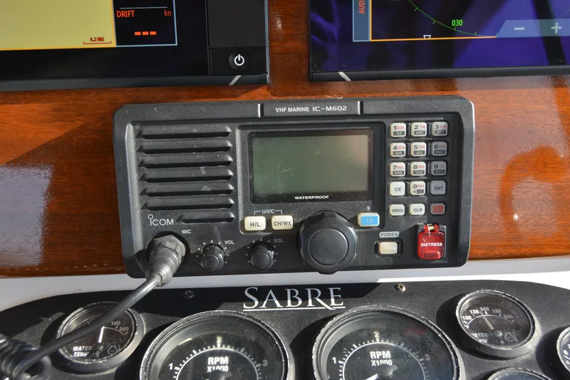 Slide: The Image of Control panel of a 2005 Sabre 38 Express with Icom VHF Marine IC-M602 radio. - 48