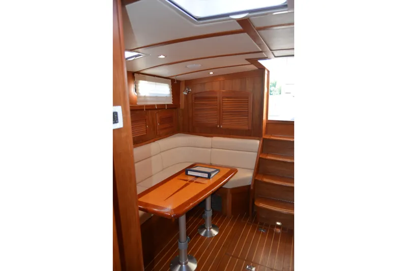 Slide: The Image of Luxurious interior of 2005 Sabre 38 Express yacht with wooden finishes and cozy seating. - 92