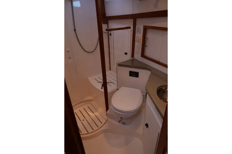 Slide: The Image of 2005 Sabre 38 Express yacht bathroom with shower, toilet, and sink. - 88