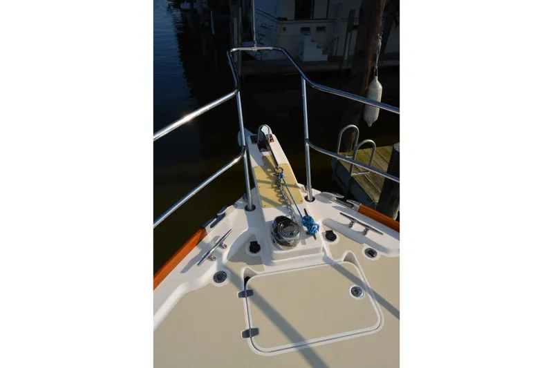 Slide: The Image of Bow of 2005 Sabre 38 Express yacht with anchor and railing. - 9