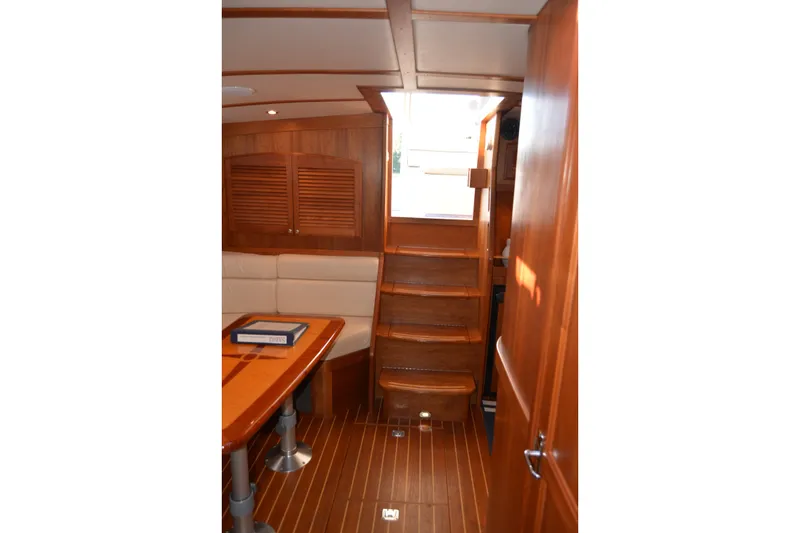 Slide: The Image of Interior of 2005 Sabre 38 Express yacht with wooden stairs and seating area. - 93