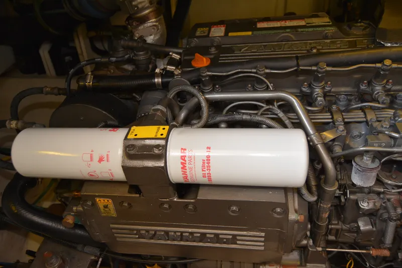 Slide: The Image of Engine of a 2005 Sabre 38 Express boat with Yanmar parts visible. - 104
