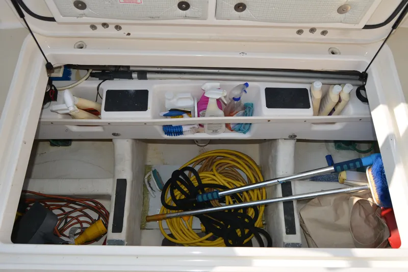 Slide: The Image of Storage compartment of 2005 Sabre 38 Express boat with cleaning supplies and equipment. - 33