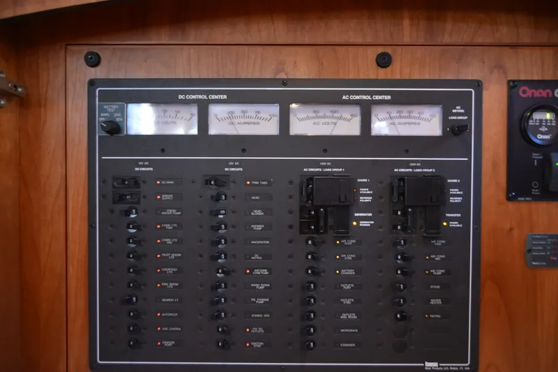 Slide: The Image of Electrical control panel on a 2005 Sabre 38 Express boat, featuring DC and AC systems. - 80