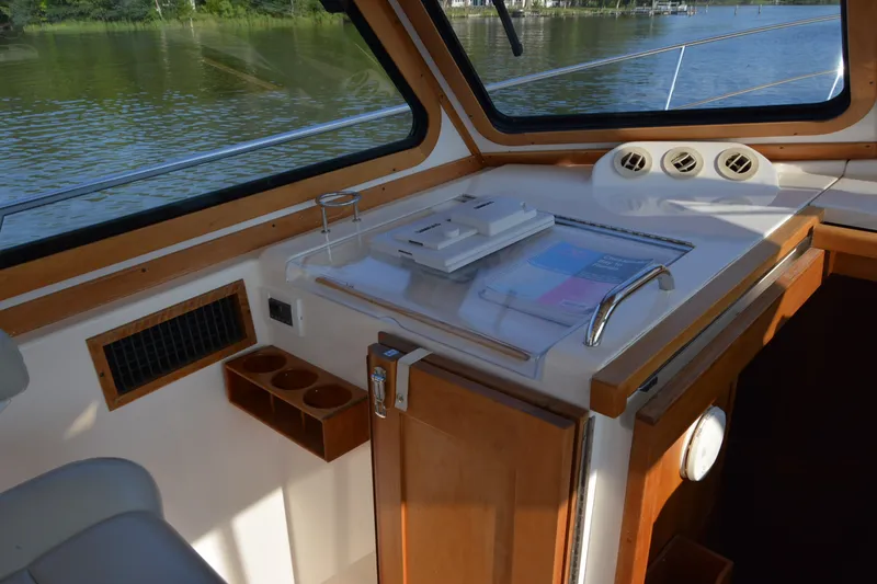 Slide: The Image of Interior of 2005 Sabre 38 Express boat with wooden cabinetry and water view. - 55