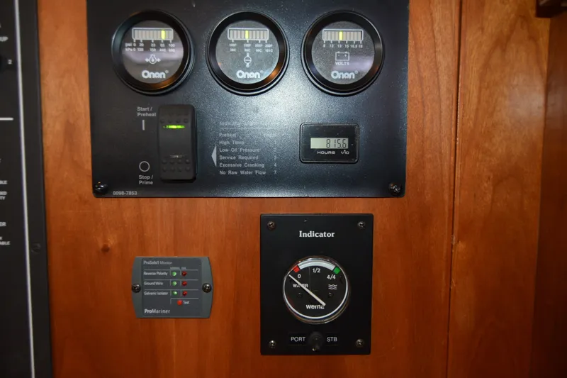Slide: The Image of Control panel of a 2005 Sabre 38 Express boat with gauges and indicators. - 79
