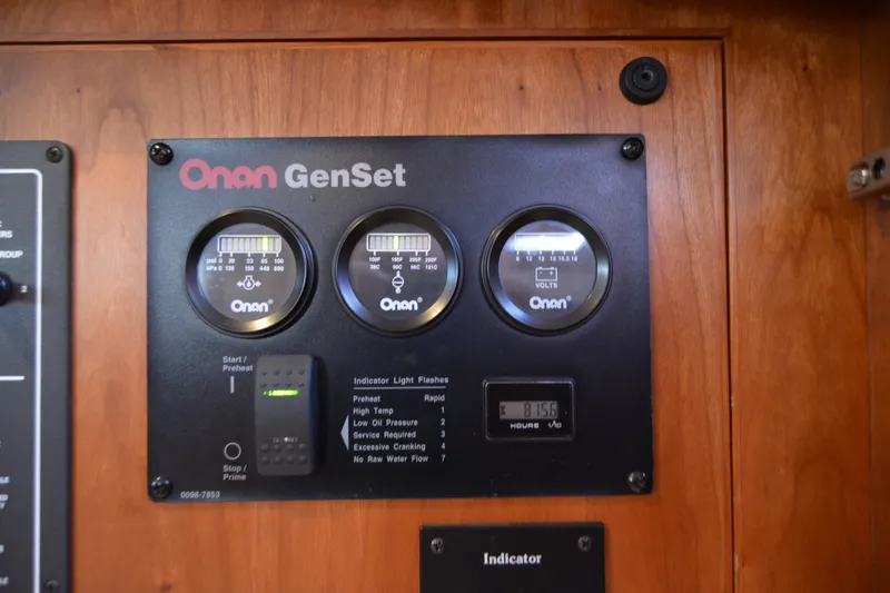 Slide: The Image of Onan GenSet control panel on 2005 Sabre 38 Express boat. - 78