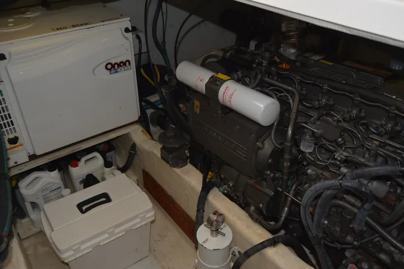 Slide: The Image of Engine room of 2005 Sabre 38 Express with Onan generator and Yanmar engine. - 98
