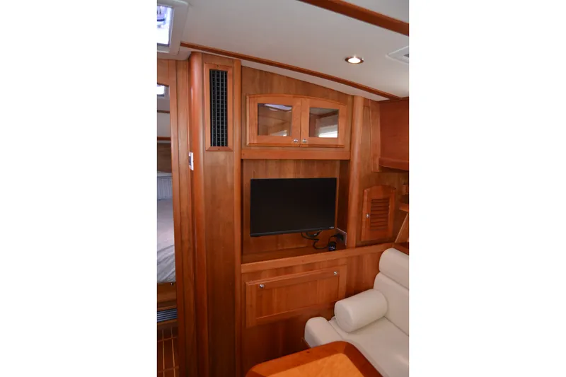 Slide: The Image of Interior of 2005 Sabre 38 Express yacht with wooden cabinetry and mounted TV. - 81