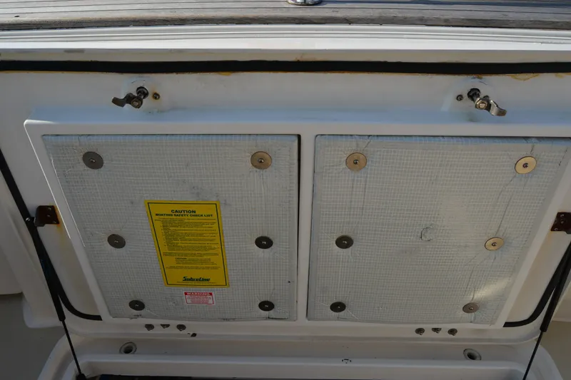 Slide: The Image of Engine compartment of 2005 Sabre 38 Express boat with safety checklist. - 32