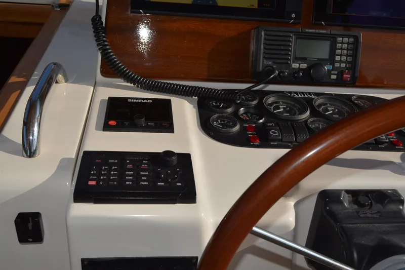 Slide: The Image of Control panel of a 2005 Sabre 38 Express boat with navigation instruments. - 42