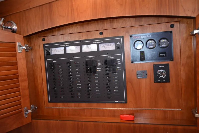 Slide: The Image of Electrical control panel inside a 2005 Sabre 38 Express boat cabin. - 76