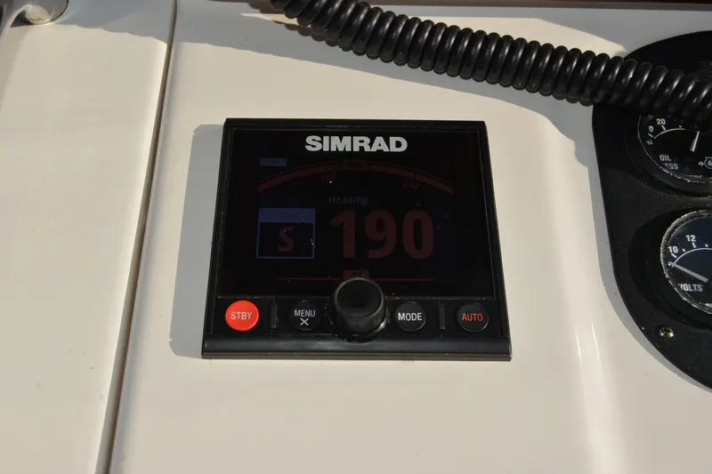 Slide: The Image of Simrad navigation display on 2005 Sabre 38 Express boat dashboard. - 43