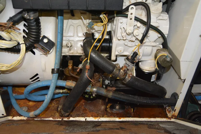 Slide: The Image of Engine compartment of a 2005 Sabre 38 Express boat, showing hoses and components. - 113