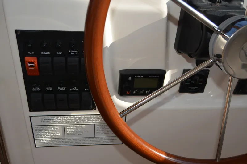Slide: The Image of 2005 Sabre 38 Express helm with steering wheel and control panel. - 45