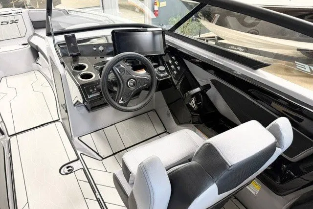Slide: The Image of 2026 Yamaha Boats 255XD cockpit with modern controls and sleek design. - 10