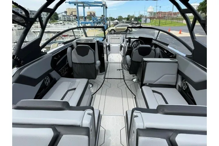 Slide: The Image of 2026 Yamaha Boats 255XD interior with sleek seating and modern design. - 37