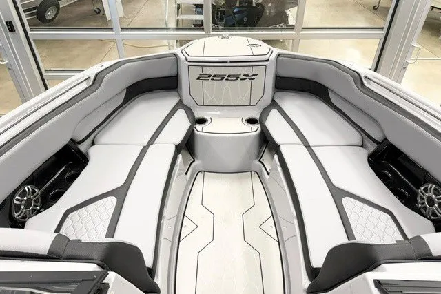 Slide: The Image of 2026 Yamaha Boats 255XD interior, featuring sleek seating and modern design elements. - 15