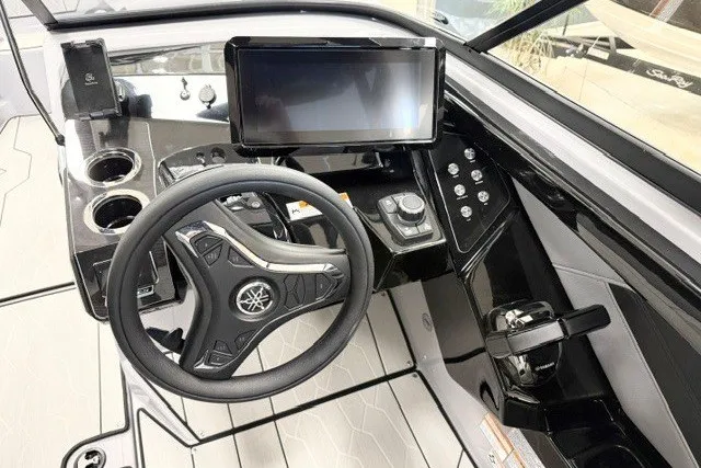 Slide: The Image of 2026 Yamaha Boats 255XD dashboard with steering wheel, touchscreen, and control panel. - 11