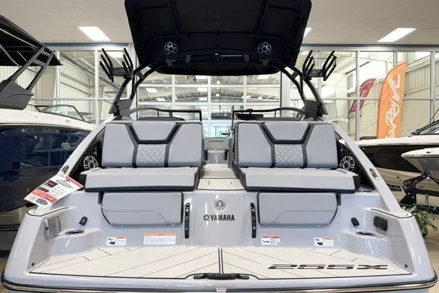 Slide: The Image of 2026 Yamaha Boats 255XD, sleek design, luxury seating, showcased in a modern showroom. - 4