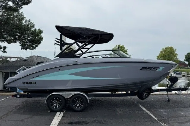 Slide: The Image of 2026 Yamaha Boats 255XD on trailer, sleek design, parked near waterfront. - 20