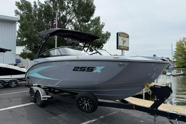 Slide: The Image of 2026 Yamaha Boats 255XD on trailer, sleek design, parked near marina. - 21