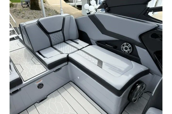 Slide: The Image of 2026 Yamaha Boats 255XD interior with sleek gray seating and modern design elements. - 26