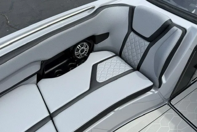 Slide: The Image of 2026 Yamaha Boats 255XD interior seating with modern design and speaker system. - 24