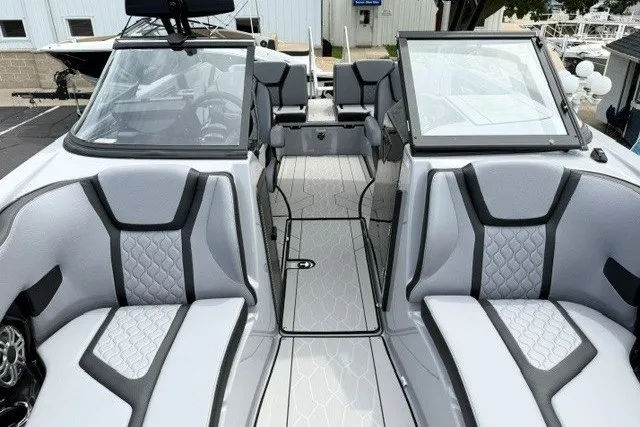 Slide: The Image of 2026 Yamaha Boats 255XD interior with sleek gray seating and modern design. - 32
