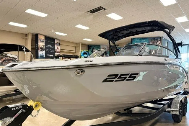 Slide: The Image of 2026 Yamaha Boats 255XD displayed indoors on a trailer, showcasing sleek design and modern features. - 3