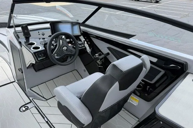 Slide: The Image of 2026 Yamaha Boats 255XD cockpit with modern steering and touchscreen display. - 29